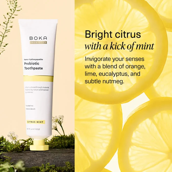 Boka Probiotic Toothpaste with lemon slices on a yellow background