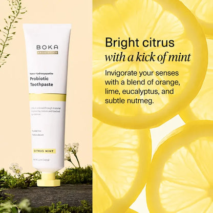 Boka Probiotic Toothpaste with lemon slices on a yellow background