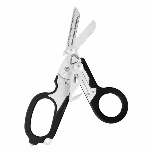 Open Black Leatherman Raptor Rescue trauma shears with premium scissors and various tools.