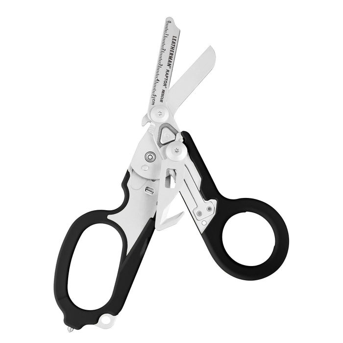 Open Black Leatherman Raptor Rescue trauma shears with premium scissors and various tools.