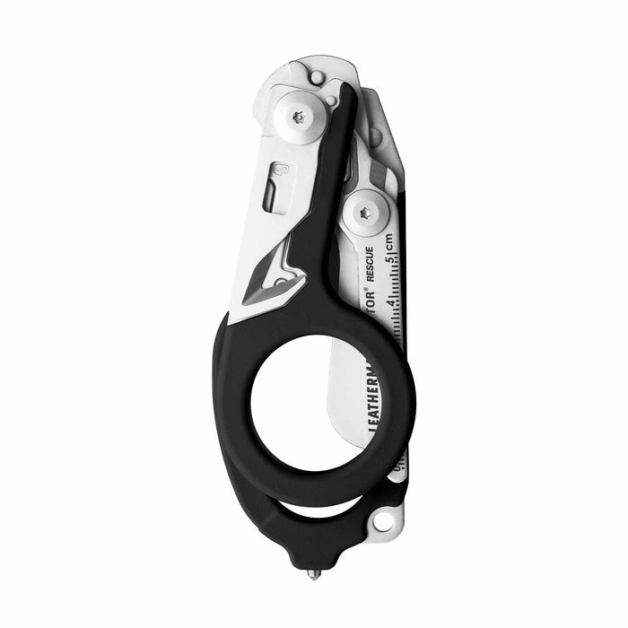 Black Leatherman Raptor Rescue trauma shears folded, showcasing its compact size.