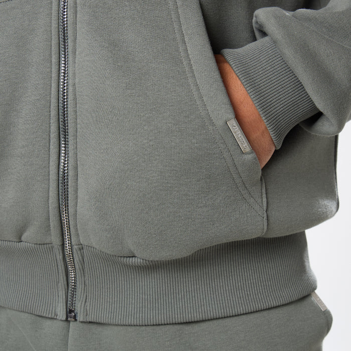Branded detailing on pocket of khaki zip up hoodie