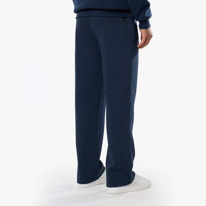 Rear view of loose fit tracksuit bottoms in navy