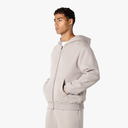 Model wearing relaxed fit hoodie in stone
