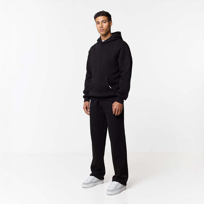 Front view of mens relaxed fit tracksuit in black