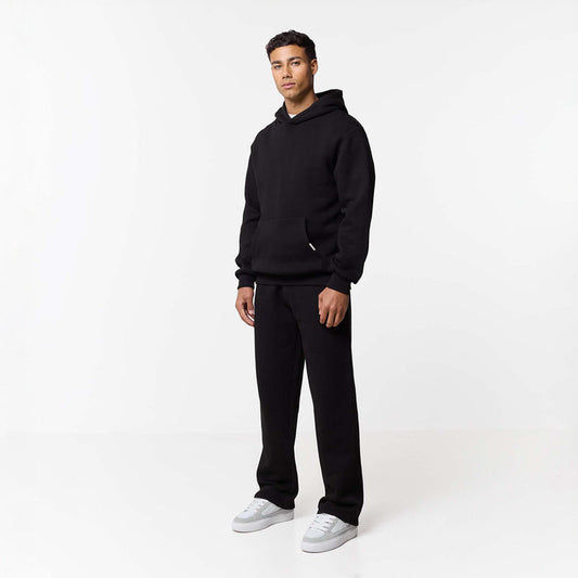 Front view of mens relaxed fit tracksuit in black