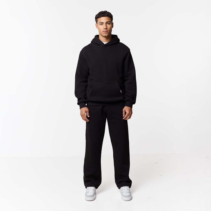 Full front view of mens black relaxed tracksuit