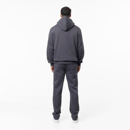 Full side view of relaxed fit tracksuit in dark grey