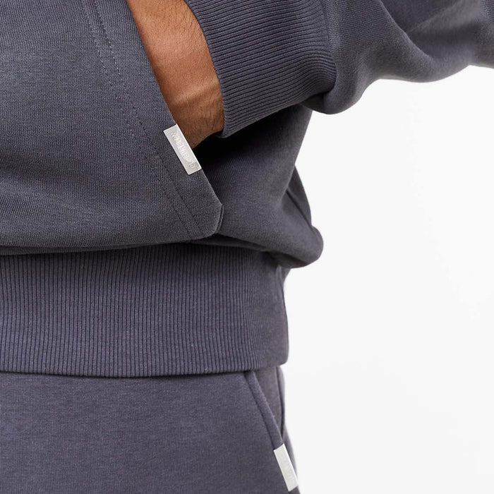Close up of branded detailing on kangaroo pocket of iron grey hoodie