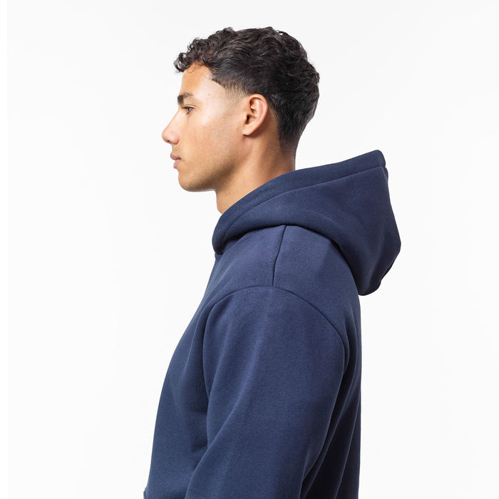 Side view of navy relaxed hoodie showcasing oversized hood