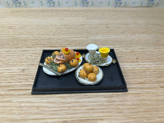 Roasted Ham Dinner with Dinner Rolls and Condiments
