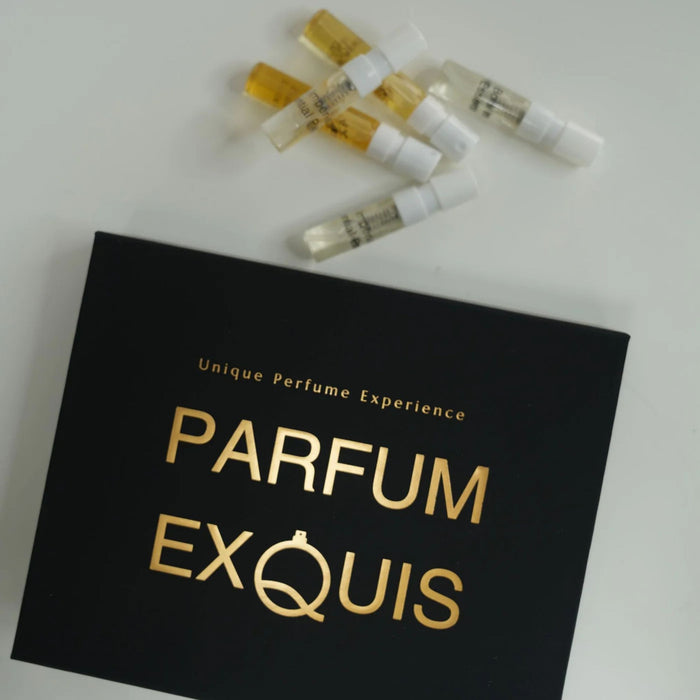 Black box with 'PARFUM EXQUIS' text and small perfume bottles on a white background