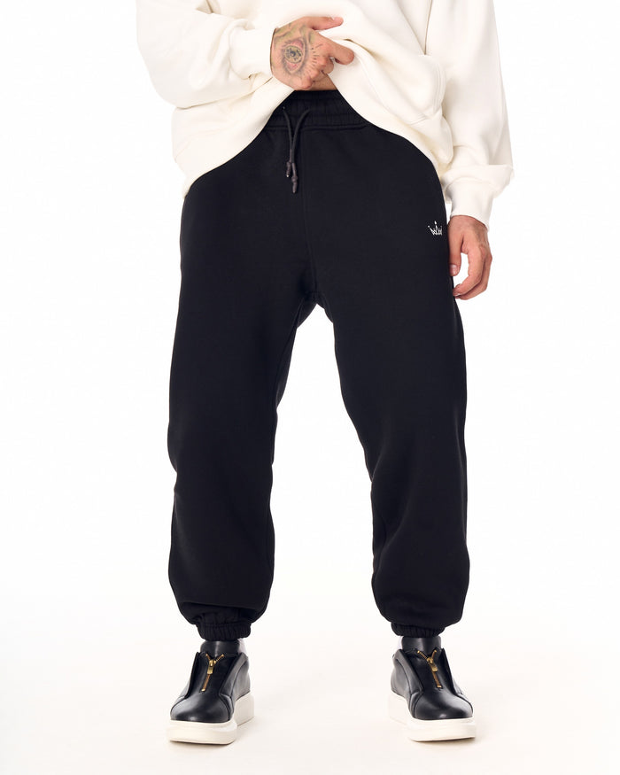 Martin Valen The Crown oversized black jogger, front waist view with drawstring and small embroidered crown logo