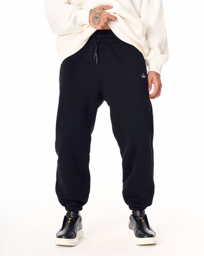 Martin Valen The Crown oversized black jogger, front waist view with drawstring and small embroidered crown logo