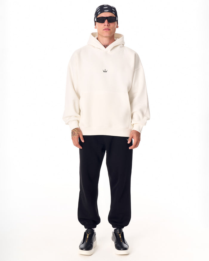 Martin Valen The Crown oversized black jogger, full front view showing elasticated cuffs and black zip-front sneakers