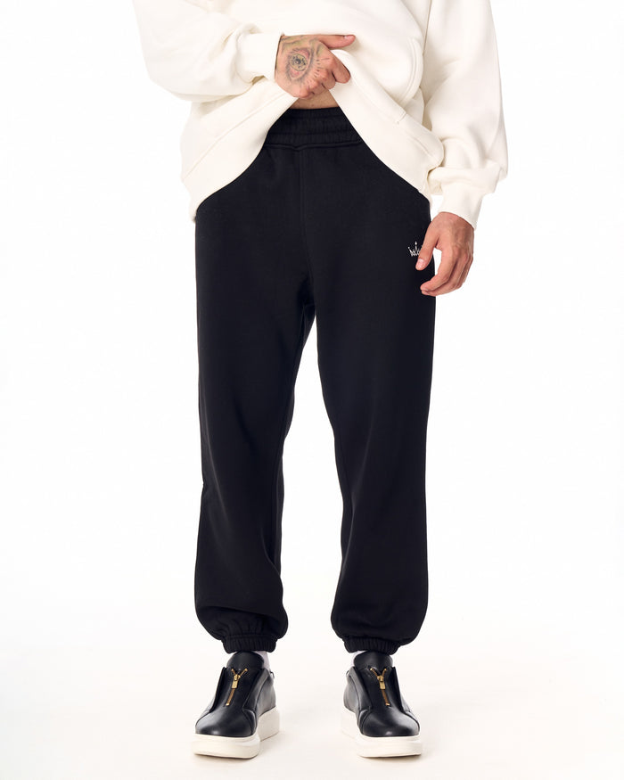 Martin Valen The Crown oversized black jogger worn with hoodie, front view showing relaxed fit and gathered ankle cuffs