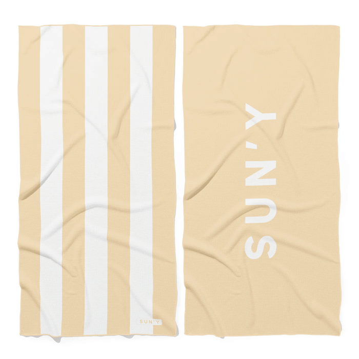Waffle Microfiber Beach Towel - Natural Sand | SUN'Y featuring wide natural sand and white stripes on one side and SUN'Y logo on the solid natural sand reverse side.