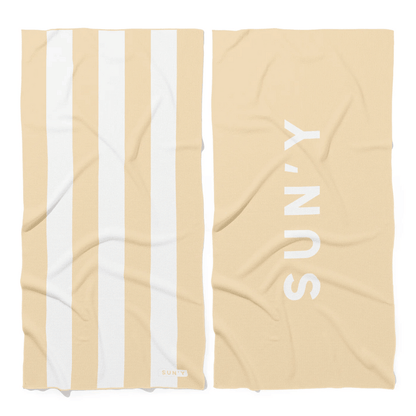 Waffle Microfiber Beach Towel - Natural Sand | SUN'Y featuring wide natural sand and white stripes on one side and SUN'Y logo on the solid natural sand reverse side.
