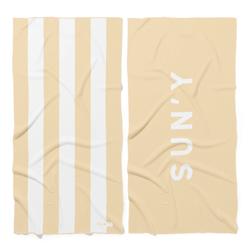 Waffle Microfiber Beach Towel - Natural Sand | SUN'Y featuring wide natural sand and white stripes on one side and SUN'Y logo on the solid natural sand reverse side.