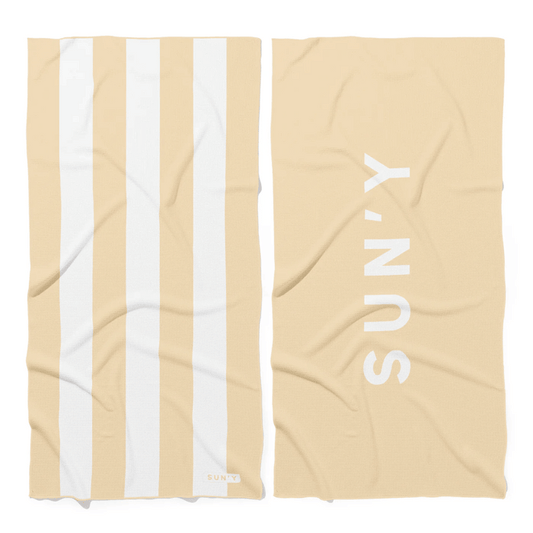 Waffle Microfiber Beach Towel - Natural Sand | SUN'Y featuring wide natural sand and white stripes on one side and SUN'Y logo on the solid natural sand reverse side.