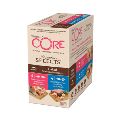 White background with a picture of a side view of a box of Wellness CORE Signature Selects wet cat food. The box is cream with text stating 'Wellness CORE, Natural, Grain Free, Protein-Rich, Signature Selects, Flaked Selection Multipack, Adult, 4x Flaked Skipjack Tuna with Salmon Entrée in Broth, 4x Flaked Skipjack Tuna with Shrimp Entrée in Broth' with a picture with a bowl of wet food below.