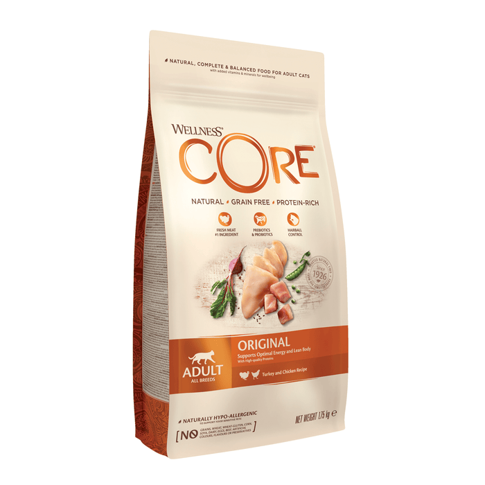 White background with a picture of a bag of Wellness CORE Original Cat Food. On the bag is pictures of chicken breast, turkey chunks, peas and a beet. The text on the bag 'Wellness CORE, Natural, Grain Free, Protein-Rich' and 'Adult, All breeds, Original'.